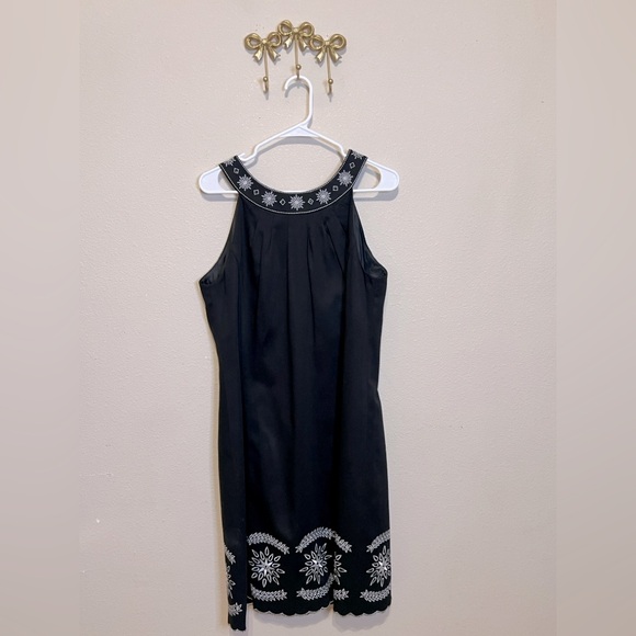 Jessica Howard Dresses & Skirts - Jessica Howard Black Midi Dress with White Embroidery at neck and bottom hem.